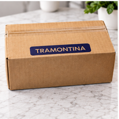 Caja de cartón con marca Tramontina, fotografiada como empaque de la cuchara SKU 23183/400.