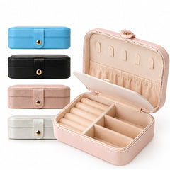 Joyero organizador de joyas abierto con colores azul negro rosa y blanco