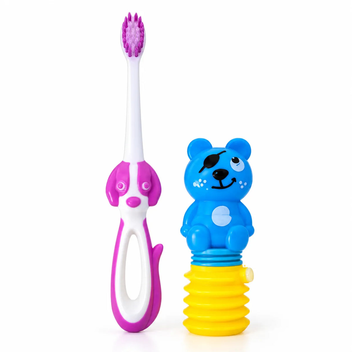 Cepillo dental infantil blanco y fucsia con cabeza de perro junto a dispensador de pasta con forma de oso