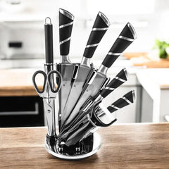 Juego de cuchillos de cocina de nueve piezas con mangos negros y soporte transparente