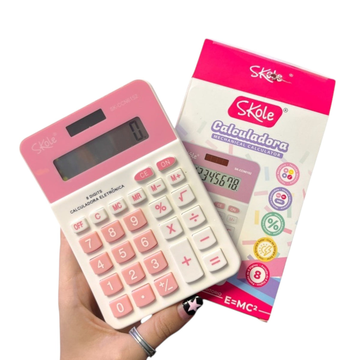 Calculadora electrónica Skole rosada junto a su caja